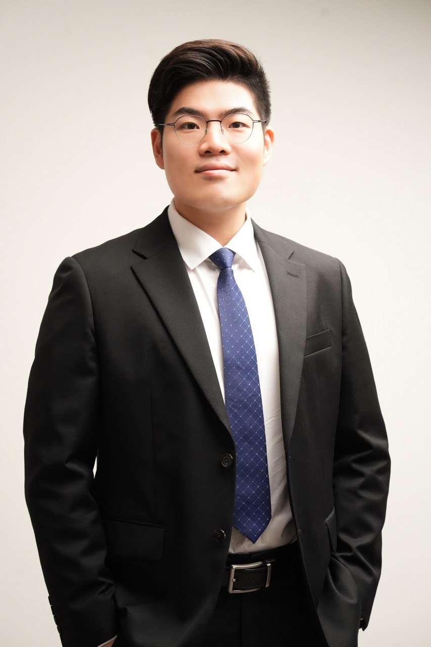 Portrait of Dr. Mark Kwon in a dark suit.